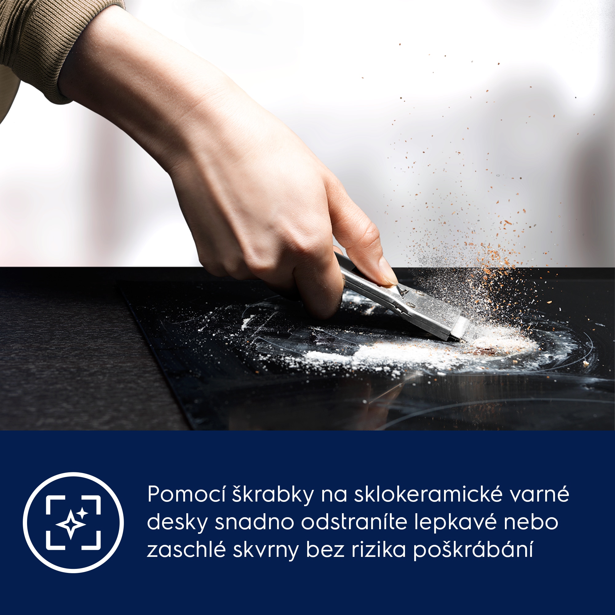 Pomocí škrabky na keramické varné desky snadno odstraníte lepkavé nebo zaschlé skvrny bez rizika poškrábání 