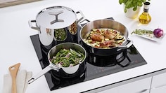 The Electrolux Infinite Chef cookware collection on an induction hob